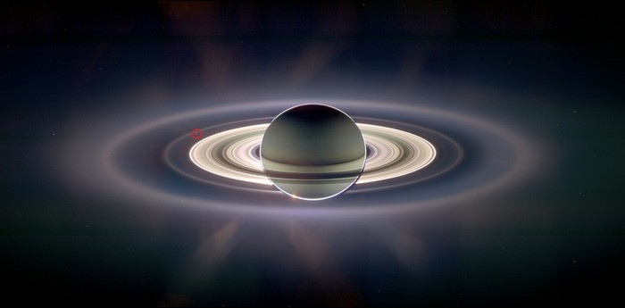 The Cassini spacecraft takes a picture of Saturn from deep space. The tiny speck of light circled in red is Earth. [2006] Source: NASA
