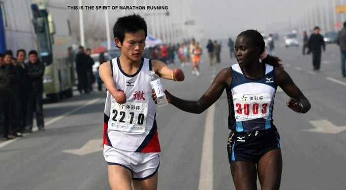  Elite runner Jaqueline Kiplimo helps a disabled Chinese athlete drink during the 2010 Zheng-Kai marathon. She stayed with him for several miles, costing her the 1st place finish and the $10000 prize. [2010]