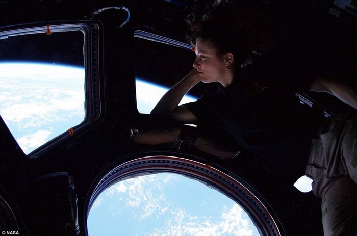  Tracy Caldwell looks down on Earth from the International Space Station [2010] Source: NASA