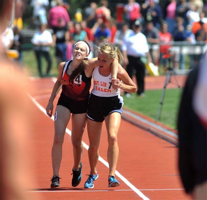  Meghan Vogel, a high school runner, helps her exhausted rival cross the finish line. [2012] Source: AP